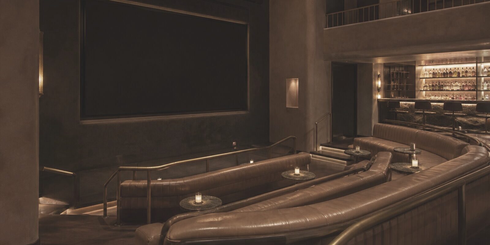 Tiered screening lounge with leather banquettes